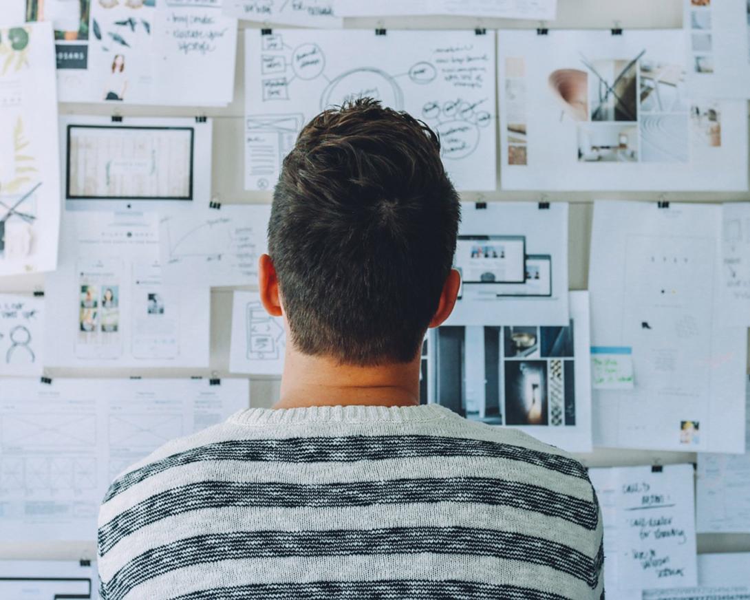 Researcher studies data on whiteboard